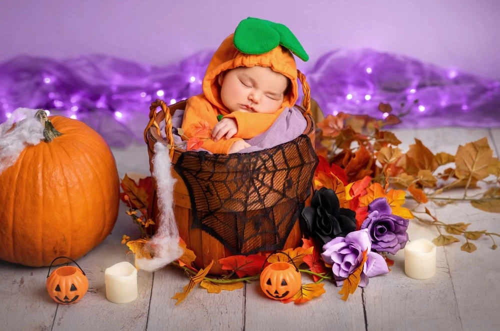 Baby Dressed as Pumpkin in Basket