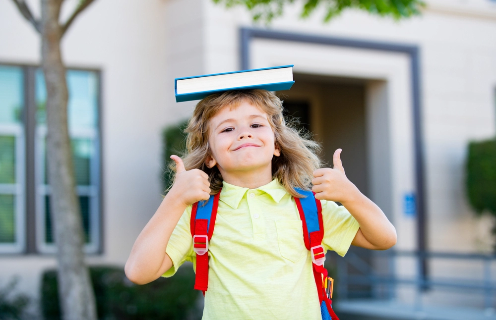 Book on Head Thumbs-Up First Day