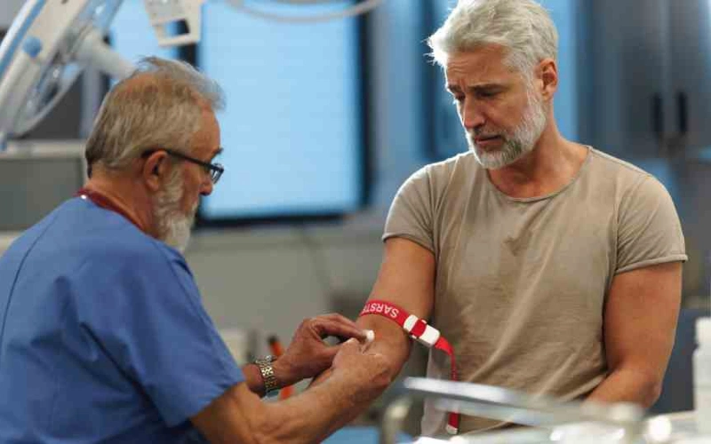 Doctor reviewing blood test results