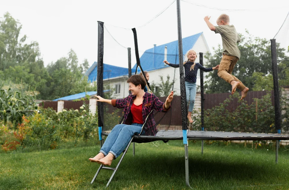 Family Bouncing Together on Backyard Trampoline