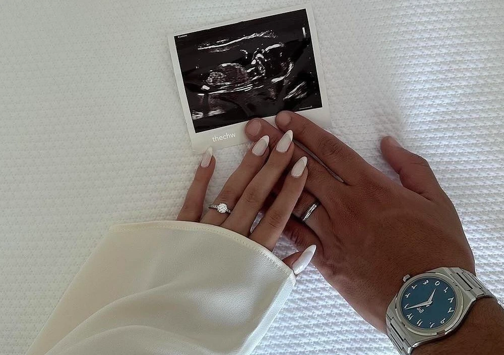 Hands Over Sonogram Reveal