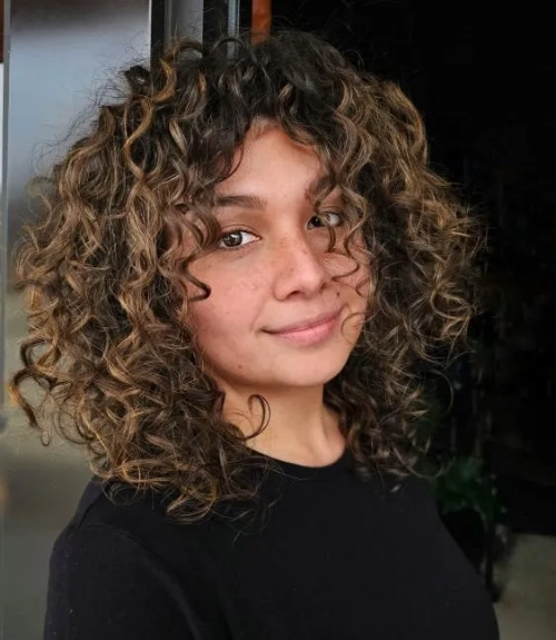 Highlighted Curly Shoulder Cut