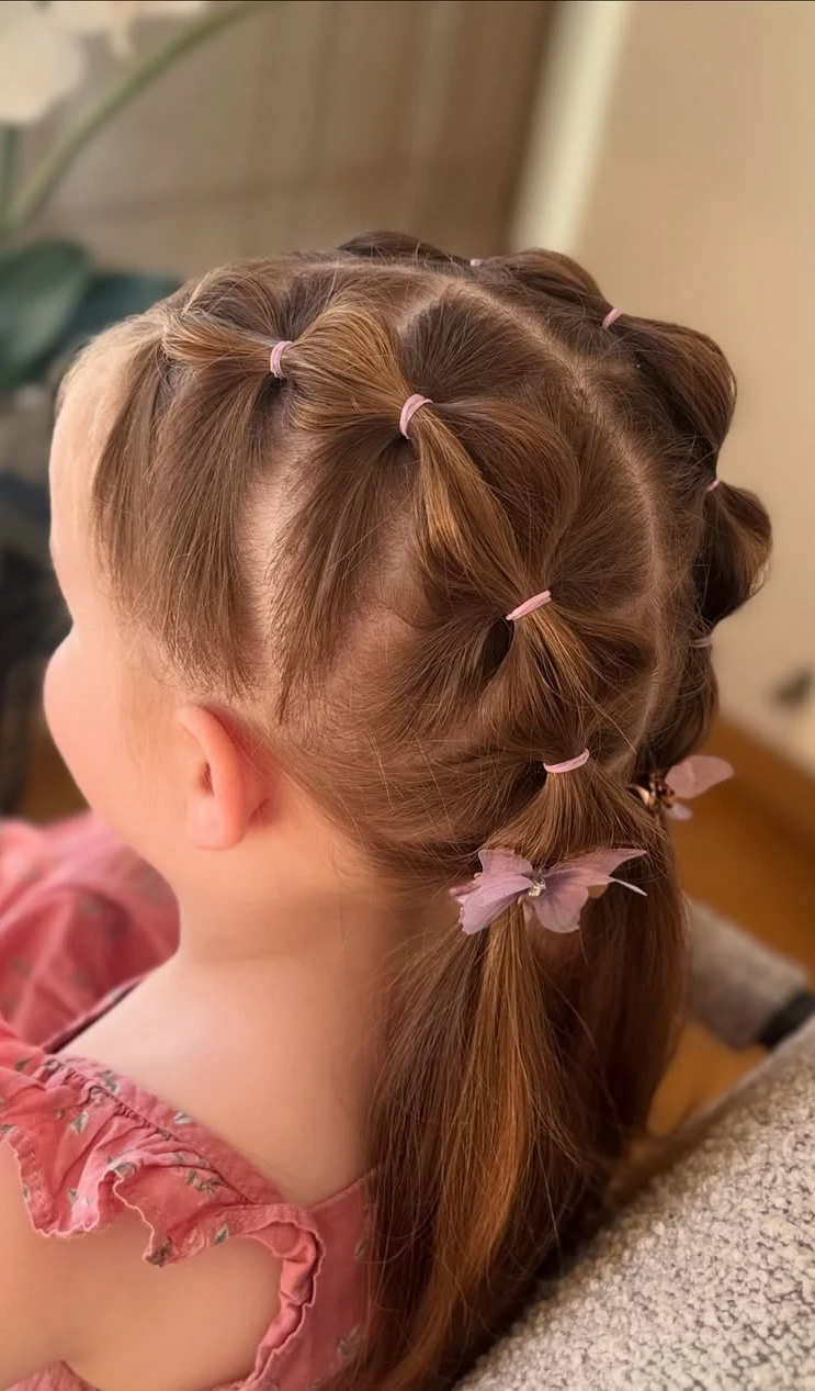 Multiple Mini Ponytails with Pink Elastics