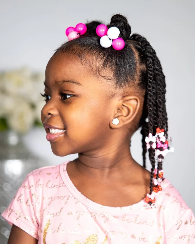 Playful Braided Ponytail with Colorful Accessories