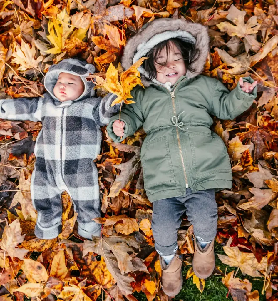 Sibling Snuggles in the Leaves