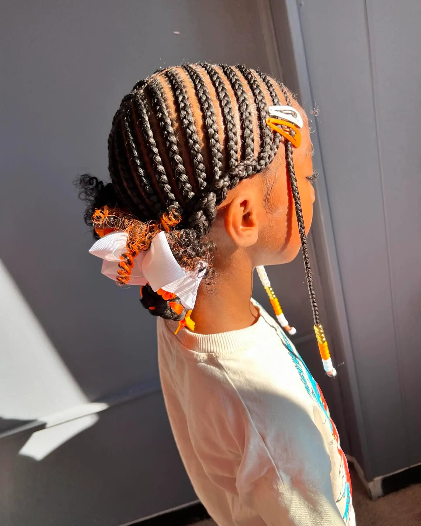 Side-Swept Cornrow Ponytail