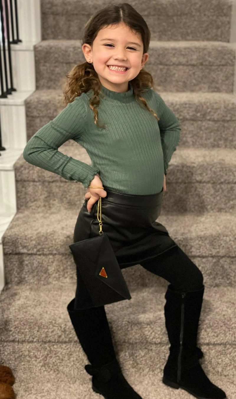 Stylish Girl in Sophisticated Green and Black Ensemble