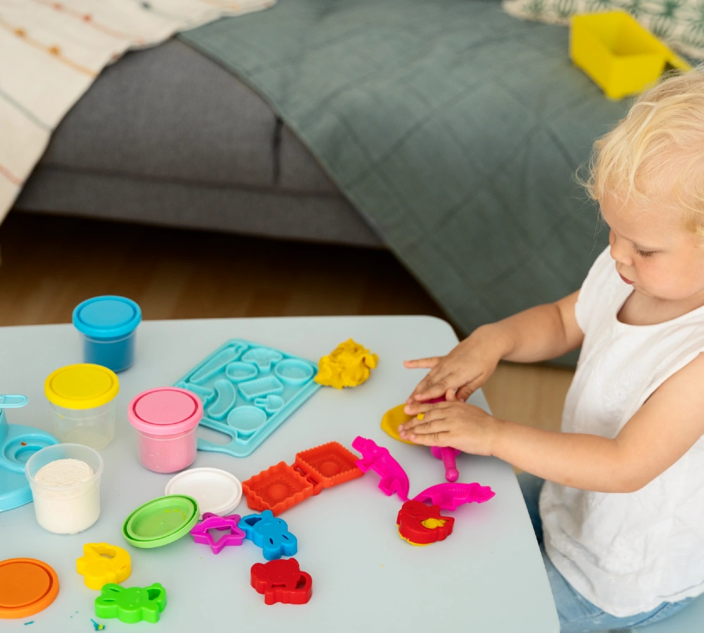 Toddler Playing with Play Dough