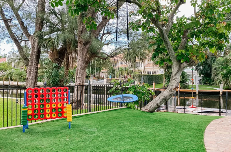 Waterfront Backyard Play Area with Giant Connect 4 Game