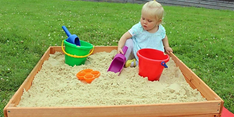 Wooden Sandbox with Colorful Sand Toys and Buckets